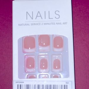 Pink based French manicure short square nails.